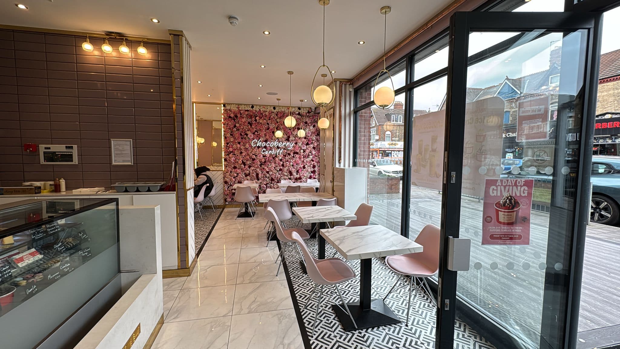 Chocoberry contemporary cafe spatial interior with marble tables and warm lighting