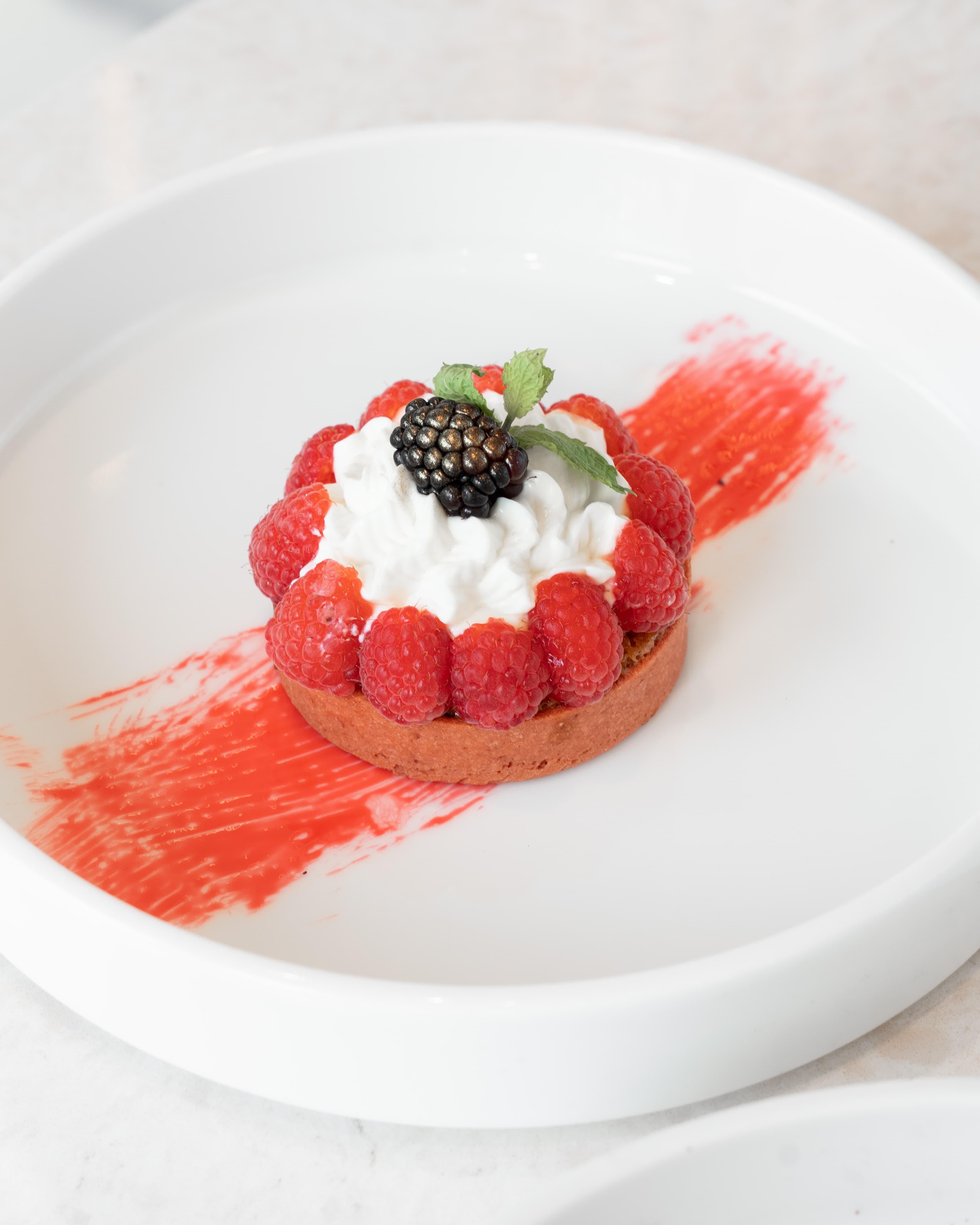 Chocoberry artisanal mixed berry tart with gold leaf